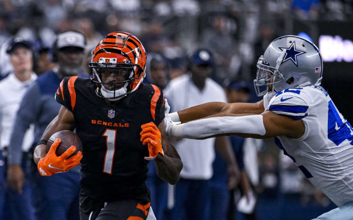Sep 18, 2022; Arlington, Texas, USA; Cincinnati Bengals wide receiver Ja'Marr Chase (1) is pushed out of bounds by Dallas Cowboys linebacker Anthony Barr (42) during the first quarter at AT&T Stadium. Mandatory Credit: Jerome Miron-USA TODAY Sports